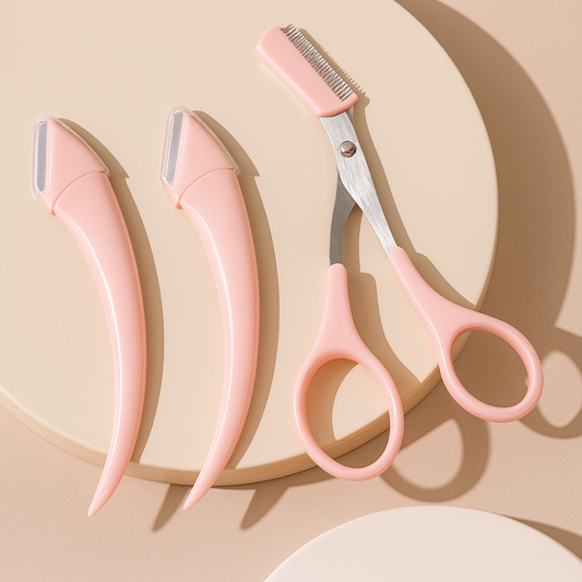 Dermaplaning razors and guarded eyebrow scissors arranged on neutral surface.